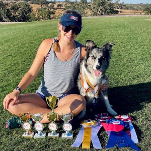 McKenzie and Safari sitting with their awards from West Coast Open